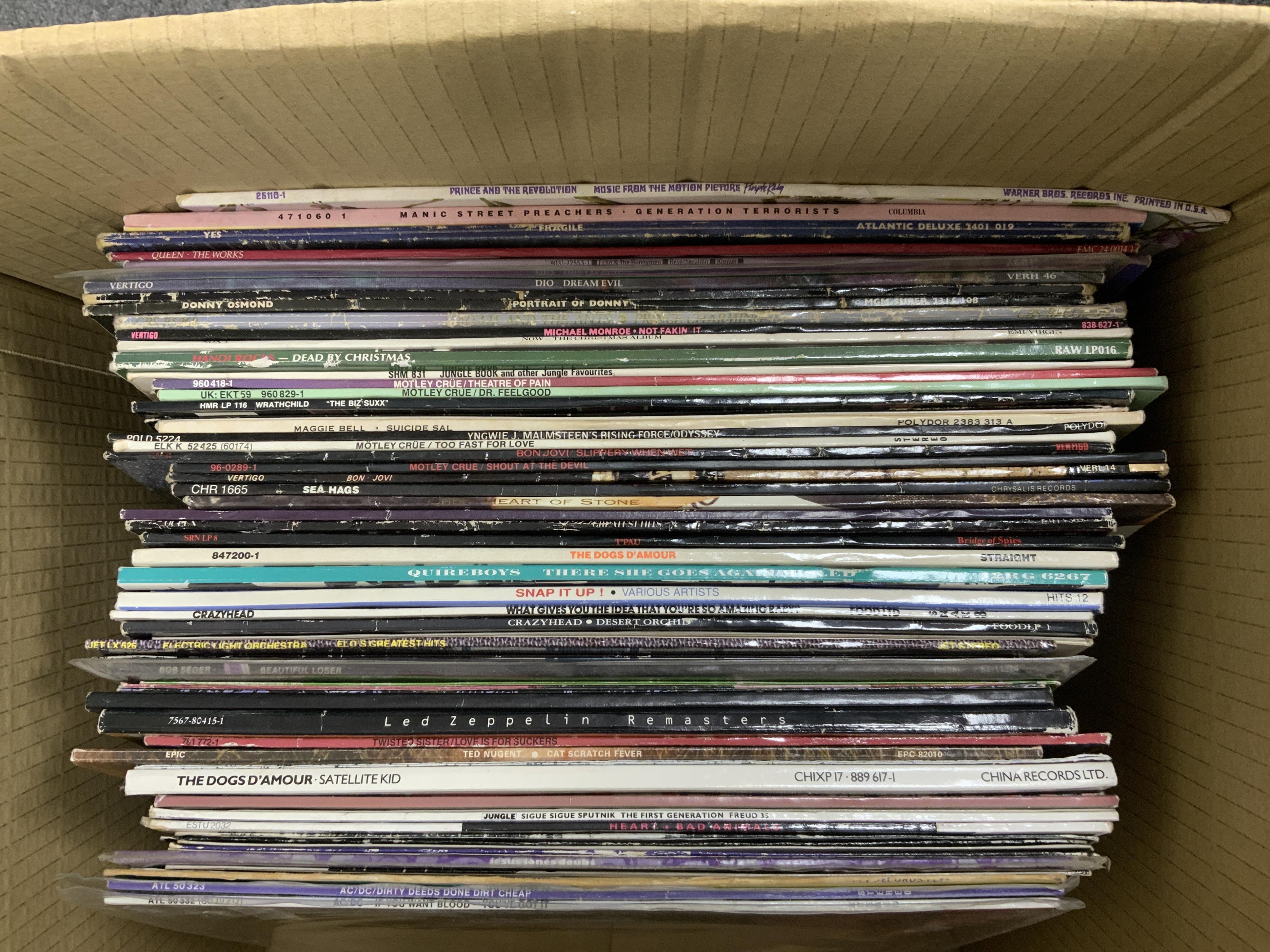 Sixty LP record albums, 12” singles, compilations, etc. artist including; Quireboys, Led Zeppelin, T’Pau, Mötley Crüe, Yes, Manic Street Preachers, Bon Jovi, etc. Condition - fair to good